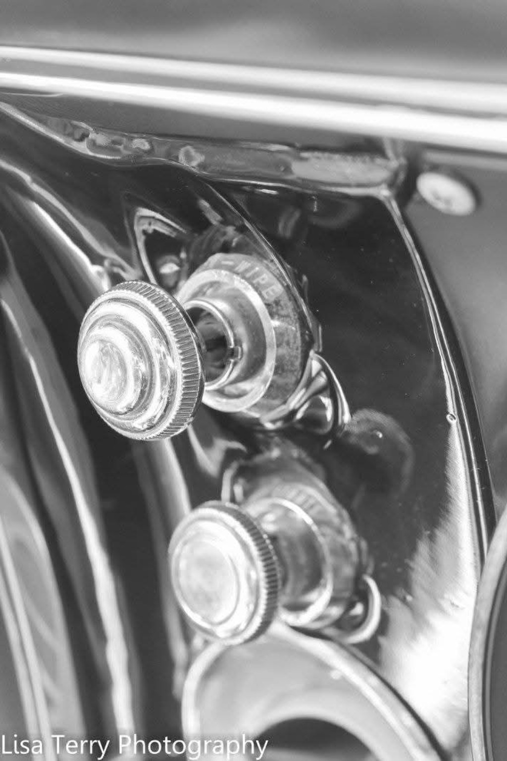 Black-and-white close-up of the dashboard controls in Chris's 1968 Camaro