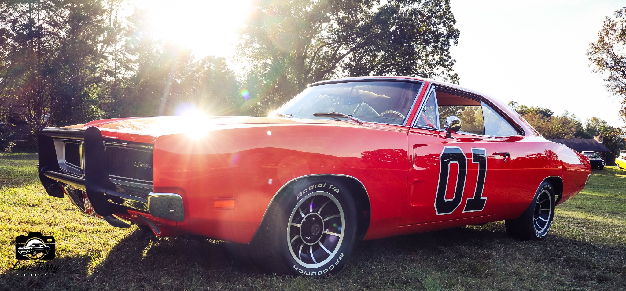 Red number 01 Dodge Charger glowing in late afternoon sunlight